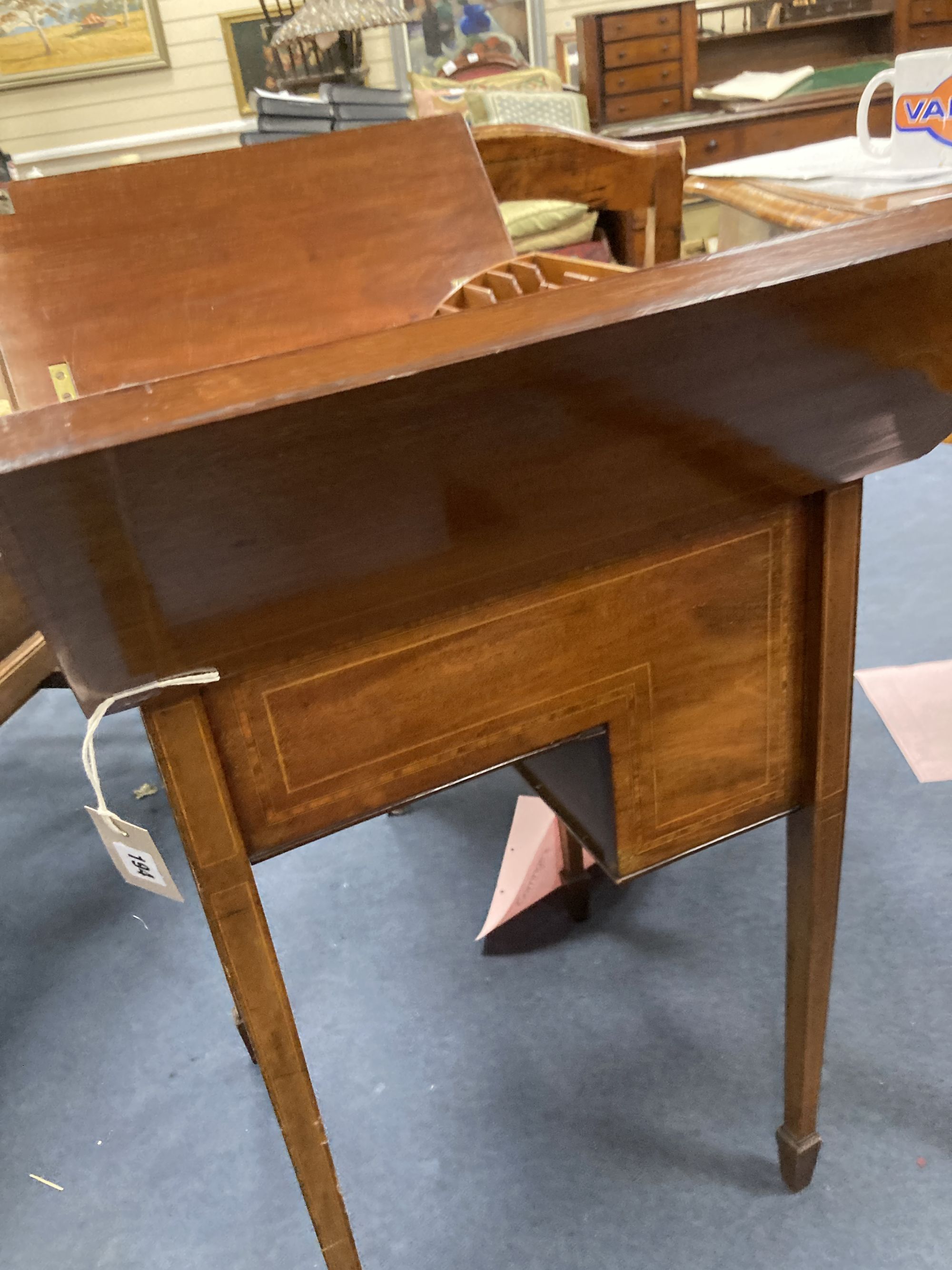 An Edwardian inlaid mahogany surprise writing table, width 48cm depth 49cm height 73cm